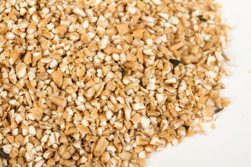Pearl barley heap isolated on white