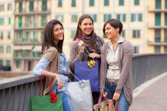 Three Beautiful Young Women with Shopping Bags