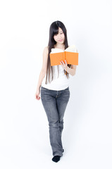 attractive asian woman reading a book