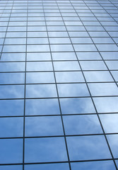 Modern office building with blue square windows.