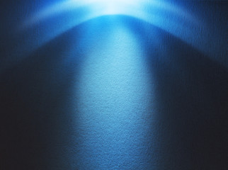Blue light beam hitting at the rough surface with copy space