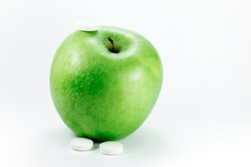 granny smith apple with pills