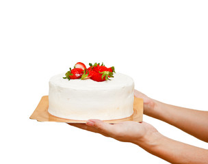 hands holding strawberry cake isolated on white background