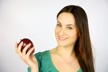 young girl smiling with red apple