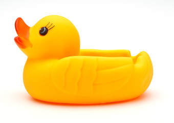 Cute yellow rubber duck isolated over white background