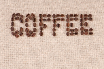 Cafe menu background: coffee beans on canvas