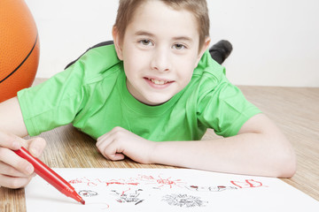 Portrait of beautiful smiling boy playing