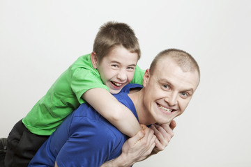 Portrait of beautiful smiling family: father and son
