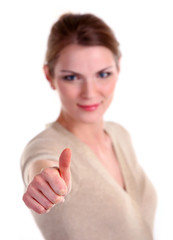 Portrait of young caucasian woman showing thumb up sign