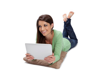 Olive skin woman smiles while surfing the web on a tablet