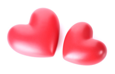 two decorative red hearts isolated on white.