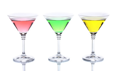 alcoholic cocktails on table isolated on white