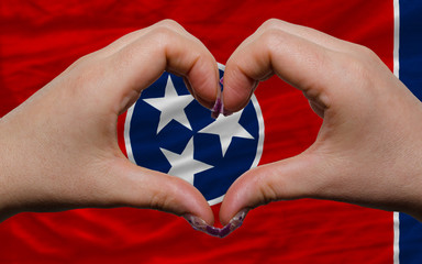 over american state flag of tennessee showed heart and love gest