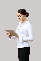 Young beautiful woman in business wear at work