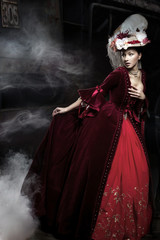 Beautiful woman wearing red dress over a train © Aarrttuurr