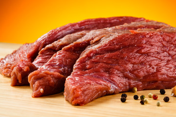 Raw beef on cutting board
