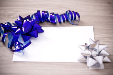 blank card to insert text, with blue ribbon and bow