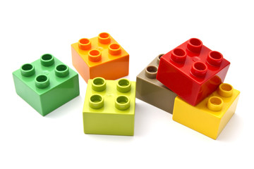 Plastic building toy blocks on white background