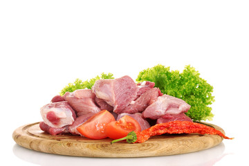 Pieces of raw meat and vegetables
