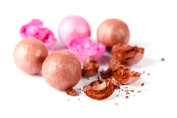 pink and brown powder balls isolated on white