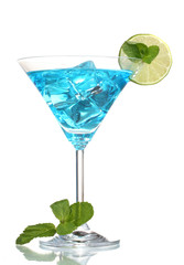Blue cocktail in martini glasses with ice isolated on white