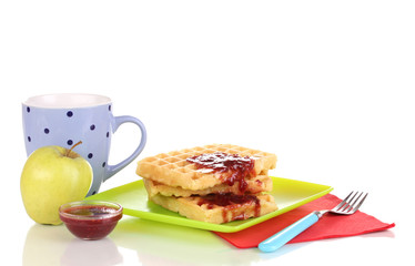 Tasty waffles with jam on plate isolated on white