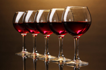Wineglasses on brown background