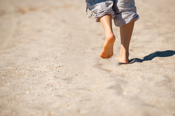 Walk barefoot on hot sand