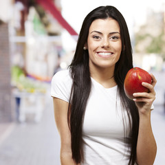 Fototapeta na wymiar woman holding a mango