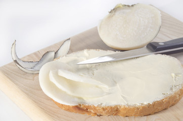 black winter radish on a slice of bread