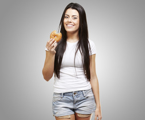 woman holding a donut