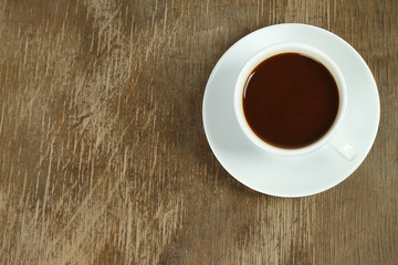 Cup of coffee on an old wooden background
