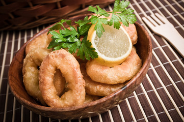 Breaded squids slices baked on deep oil