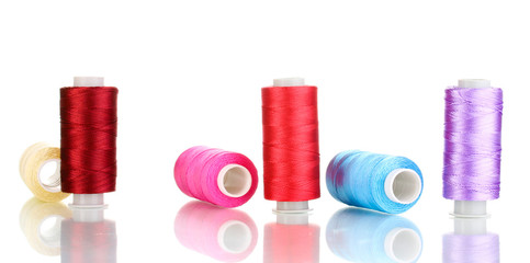 Many spools of thread isolated on white