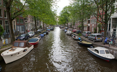 Fototapeta na wymiar Narrow Amsterdam Canal Overcast