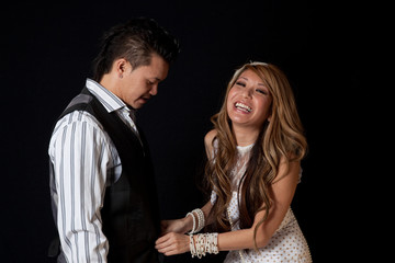 East Asian couple together as friends, laughing together