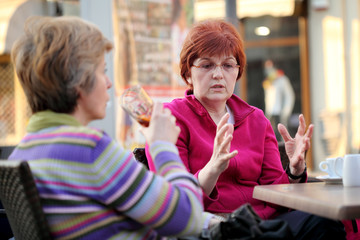 People in cafe, two mid adult woman