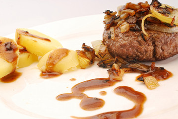 homemade burger with onions and gravy