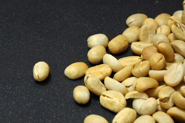 Fresh coffee beans not roast  on background color