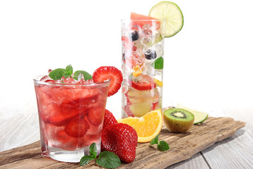 Fruit drink on wooden background
