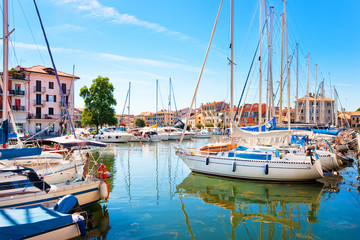 Beautiful scene of boats in Grado, Italy - obrazy, fototapety, plakaty