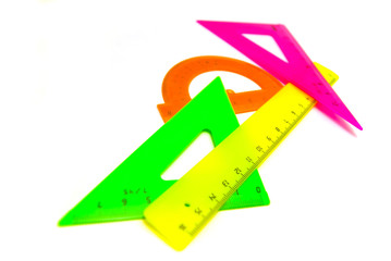 colored rulers close-up on white