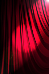 Brightly lit curtains in theatre concept