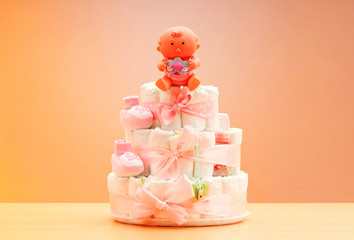 Cakes made of diapers on white