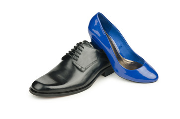 Male and female shoes on white