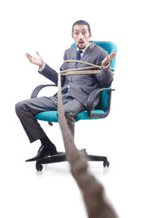 Businessman tied with rope