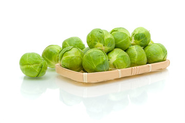Brussels sprouts on a white background with reflection