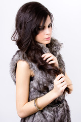 sophisticated and beautiful Latin model with fur coat