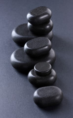 Spa stones on grey background