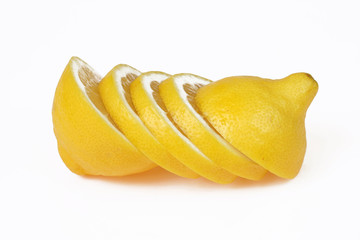 Sliced up lemon isolated on white.